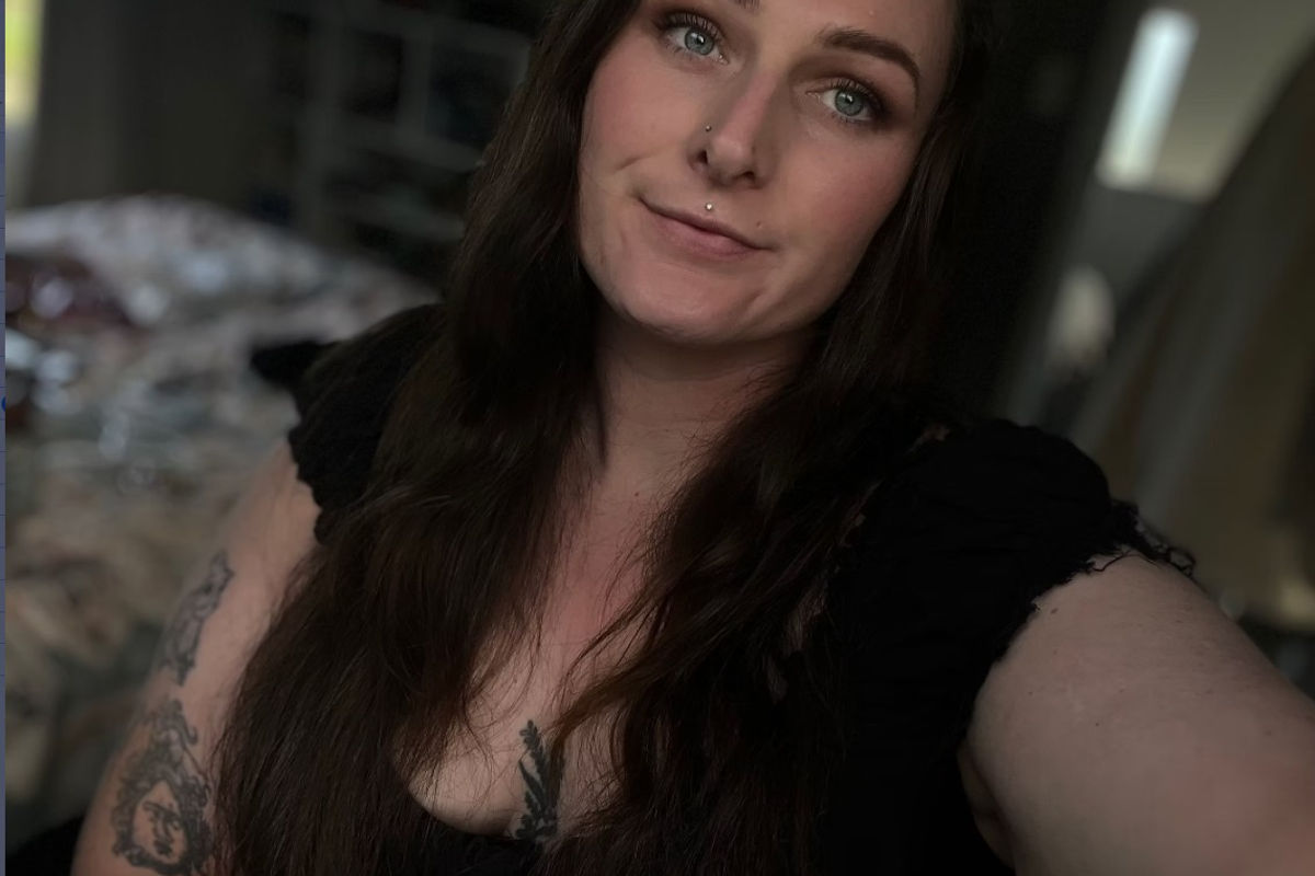Portrait of writer Madison taking a selfie.